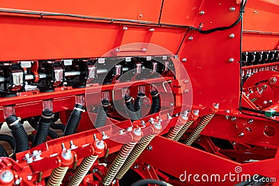 Fragment of a precision grain seeder. Spring system of agricultural seeder close up. Selective focus Stock Photo