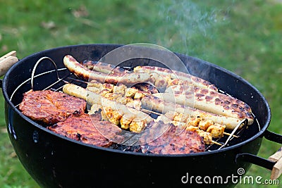 Spring Time,Barbecue in the Garden with steaks Stock Photo