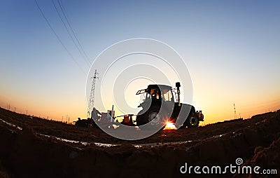 The tractor in farmland farming Stock Photo