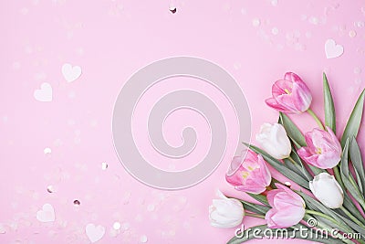 Spring tulip flowers on pastel pink background top view. Greeting card for International Women Day, Mother day. Flat lay Stock Photo