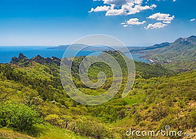 Spring view from Karadag volcanic mountain range to Meganom cape on a Black Sea shore Stock Photo