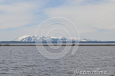 Spring in Yellowstone: Mount Sheridan of the Red Mountains Seen From Near Hard Road to Travel Picnic Area On Yellowstone Lake Stock Photo