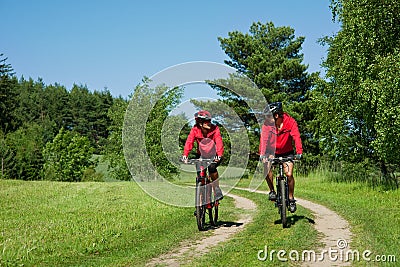 Spring - Young couple cycling in a nature Stock Photo