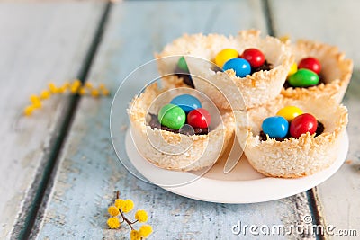 Coconut nests filled with Easter eggs Stock Photo