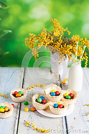 Coconut nests filled with Easter eggs Stock Photo