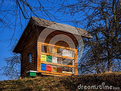 Springtime morning near the colourful bee-hive Stock Photo