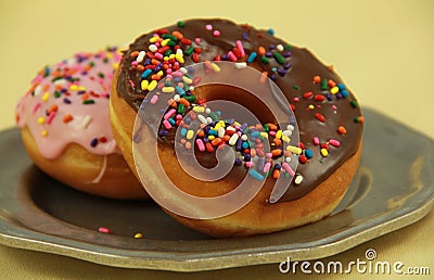 Sprinkle doughnuts Stock Photo