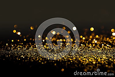 Sprinkle gold dust on a black background Stock Photo