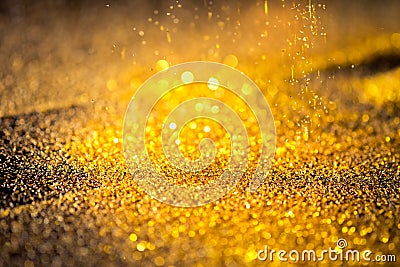 Sprinkle gold shiny dust Stock Photo