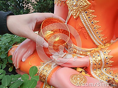 Sprinkle water onto a Buddha statue ,Songkran Stock Photo