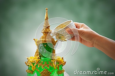 Sprinkle water onto the Emerald Buddha in songkran festival Stock Photo