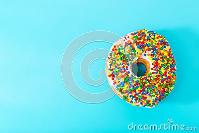 Sprinkled donut on pastel blue background Stock Photo