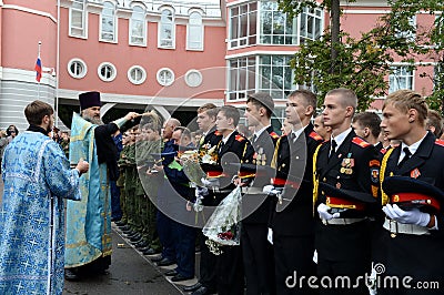 The sprinkling of Holy water cadet before the beginning of the school year. Editorial Stock Photo