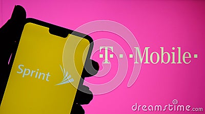 Sprint and T mobile logos on the screens of mobile devices. Concept for merger of two companies. Real photo, no edit in post Editorial Stock Photo