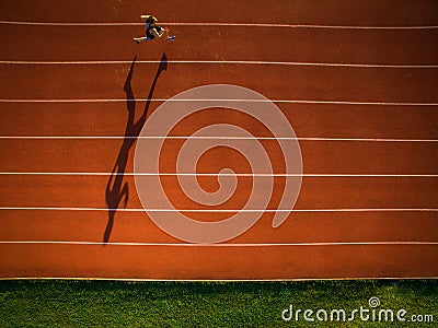 Shot of a young male athlete training on a race track Editorial Stock Photo