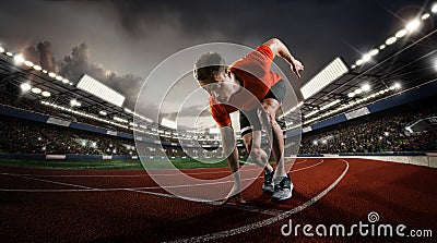 Sprinter starting on the sport arena. Dramatic image. Stock Photo