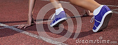 Sprinter waiting for start of race. Running tracks at outdoor stadium. Sport and fitness with running shoes Stock Photo