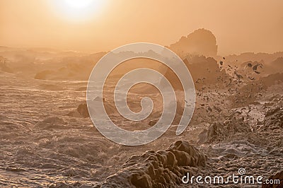 Spume in the setting sun Stock Photo