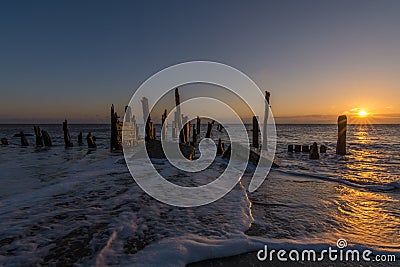 Spurn Point old wooden groynes and beach sea defences Stock Photo