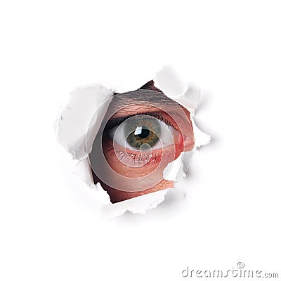 Spy eye watching through a hole Stock Photo