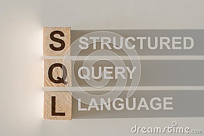 SQL abbreviation with text Structure Query Language by wood letters Stock Photo
