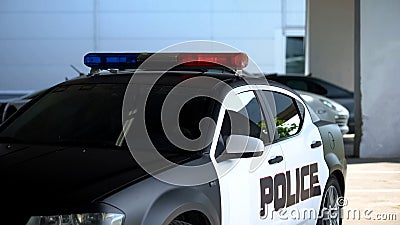 Squad car parked near police department, district patrol, maintenance of order Stock Photo