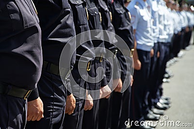 A squad of Russian police officers stands on a city street or square. Problems of opposition rallies, detentions, arrests and Stock Photo