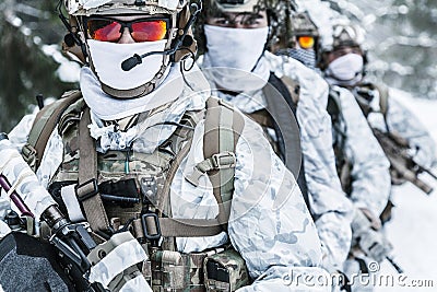 Squad of soldiers in winter forest Stock Photo