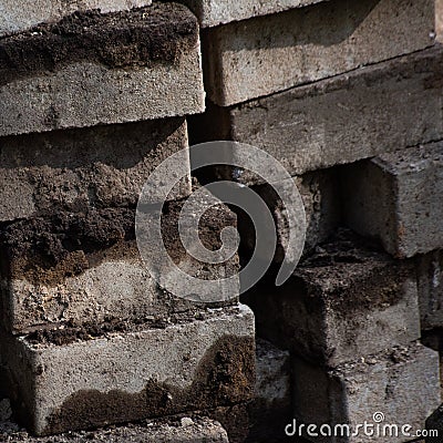 Square background with pile of dirty rectangular paving stones Stock Photo