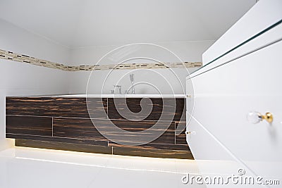 Square bathtub inside bright bathroom Stock Photo