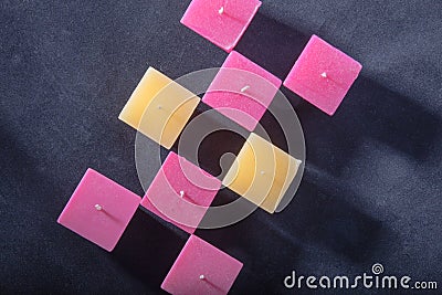 Square candle on a gray background, romantic mood, good night, l Stock Photo