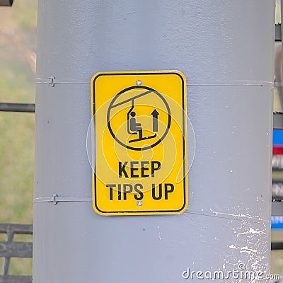 Square Chairlifts in Park City Utah at off season with safety signs on huge posts Stock Photo