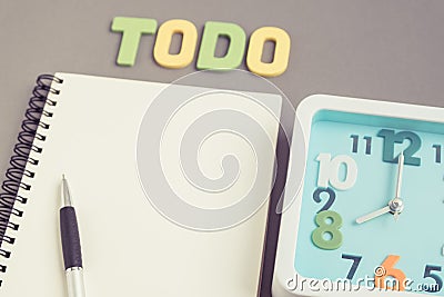 Square clock at 8 o'clock with todo wording and notebook and pen Stock Photo