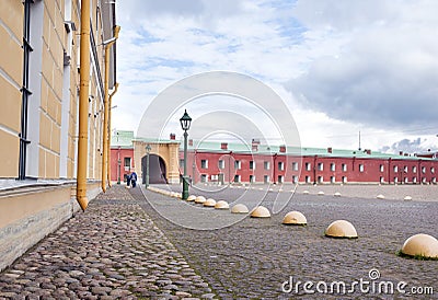 square with cobblestone pavement in the Peter and Paul fortress, St. Petersburg, buildings in the Peter and Paul fortress Stock Photo