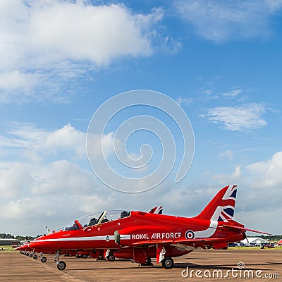 Square crop of the Red Arrows under a blue sky Editorial Stock Photo