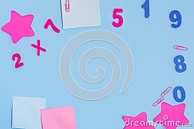 Square and curly stickers, numbers and paper clips on a blue background. Flat layout with copy space Stock Photo