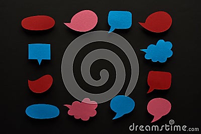 Square frame of empty speech bubbles on black background with copy space, cyberbullying concept. Stock Photo