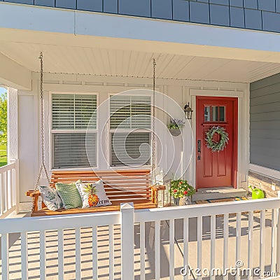 Square frame Front porch of traditional home and swinging chair Stock Photo