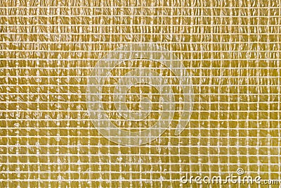 Square geometrical mosaic yellow film texture background. Waterproofing layer of construction material. Wall damp course material Stock Photo