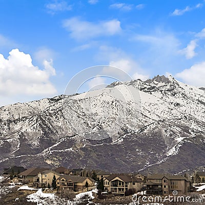 Square Houses on a mountain dusted with sharp white snow in winter Stock Photo