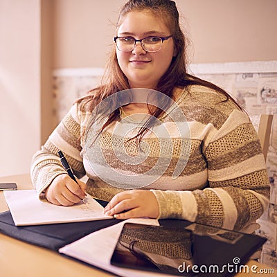 Square image of young overweight teenage girl looking at camera Stock Photo