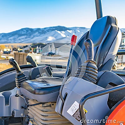 Square Interior of the open cab of a heavy duty construction machinery Stock Photo