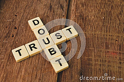 Square letters with text DOUBT and TRUST Stock Photo