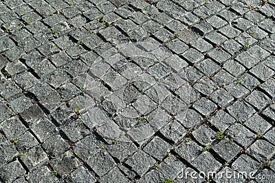 Square lined with cobblestone or stone pavement, walkway or road. Stock Photo