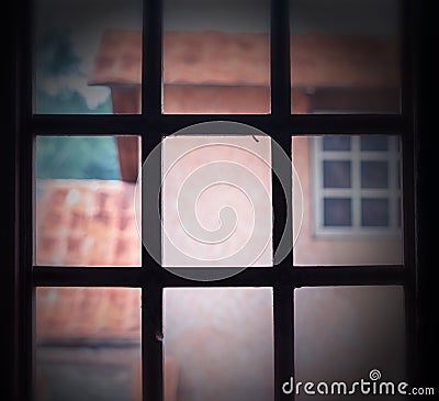 Square pale medieval wild west window Stock Photo