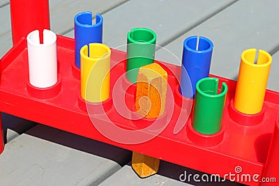 A square peg in a round hole. Stock Photo
