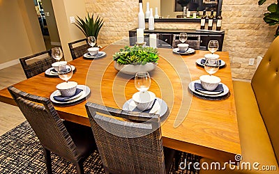 Sqare Dining Room Table With Place Settings Stock Photo