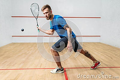 Squash game training, male player with racket Stock Photo