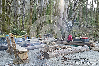 Squatters beach campsite with fire Stock Photo