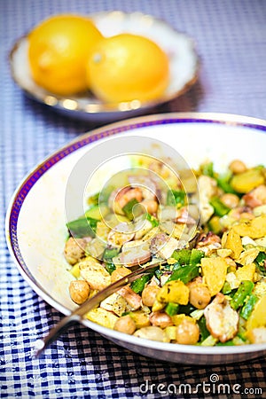 Squid salad with chickpeas, potatoes and lemon zest Stock Photo